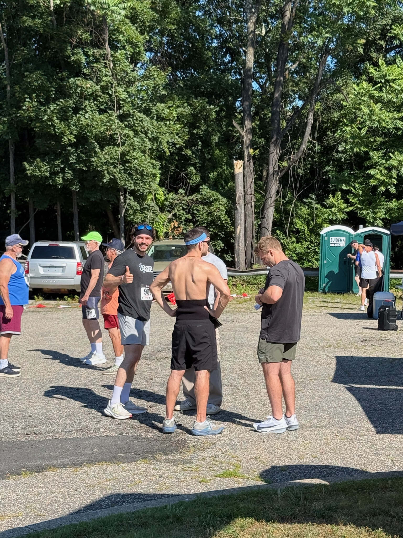 Participants gathered together talking after finishing the Heart of Gold 5K.