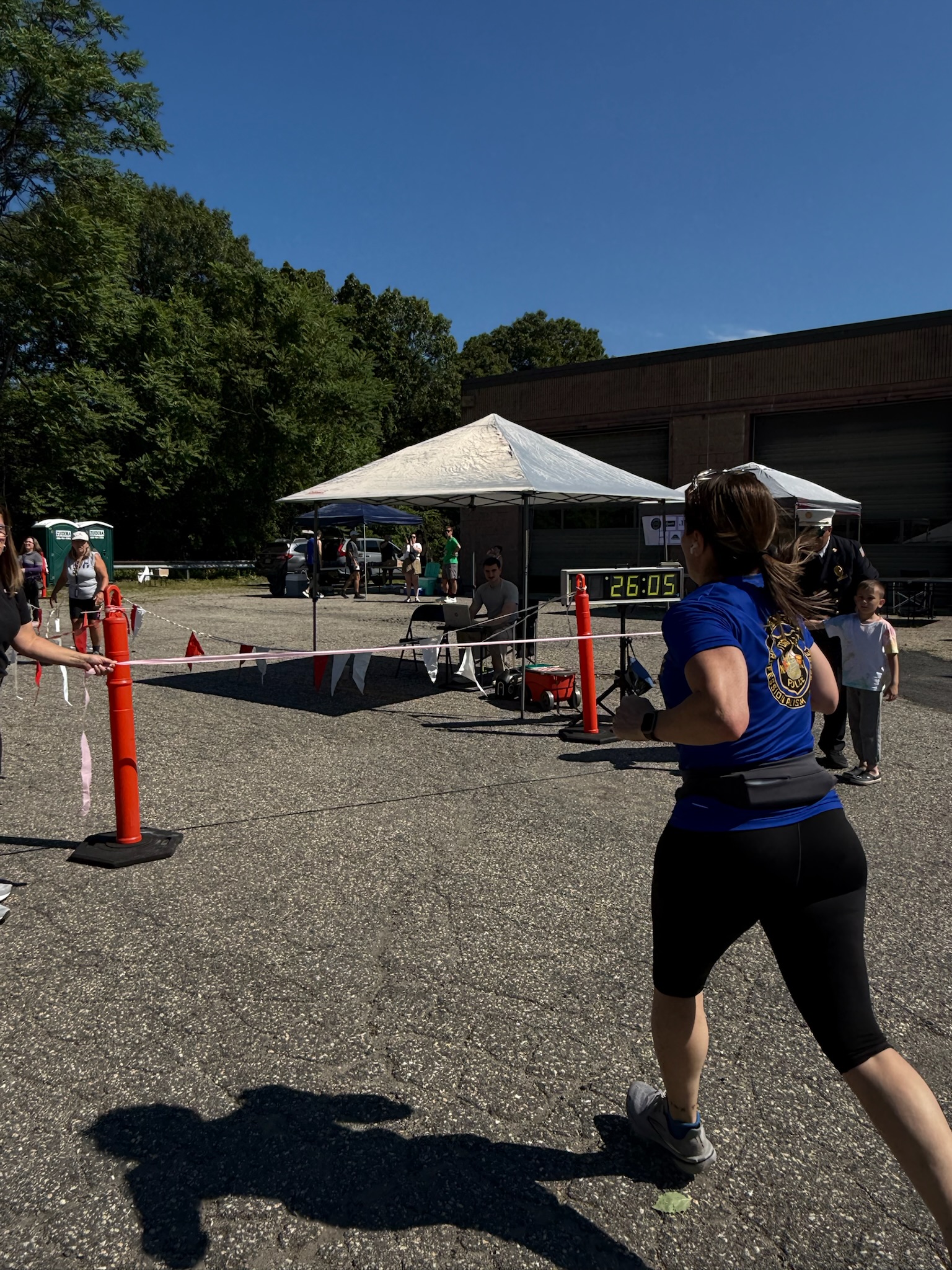 A runner approaching the finish line at the Heart of Gold 5K in Oakland, New Jersey.