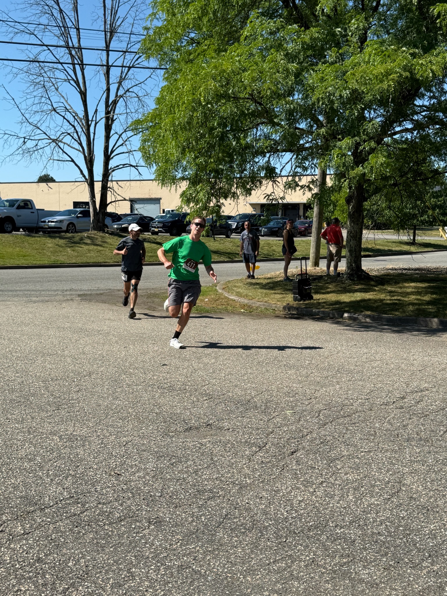 A runner moving along a shaded portion of the Heart of Gold 5K course.