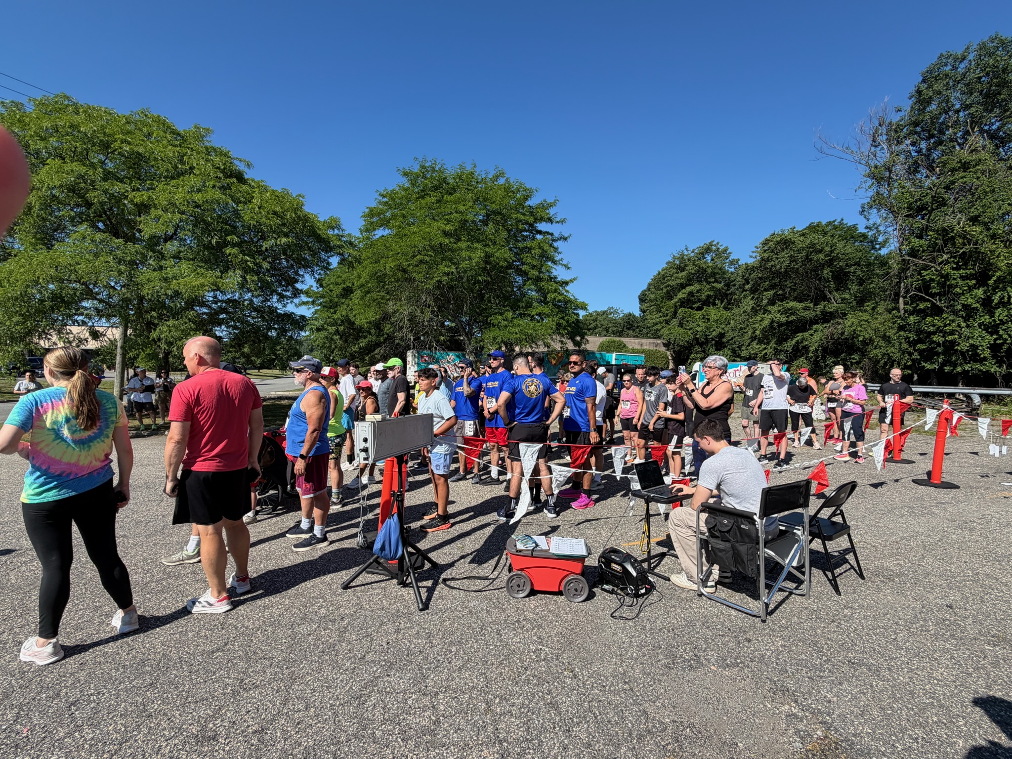 Wide view of participants gathered near the starting area at the Heart of Gold 5K in Oakland, New Jersey.