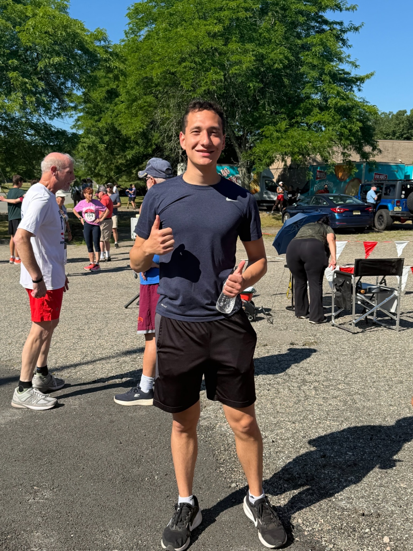A race participant standing near the event area at the Heart of Gold 5K.
