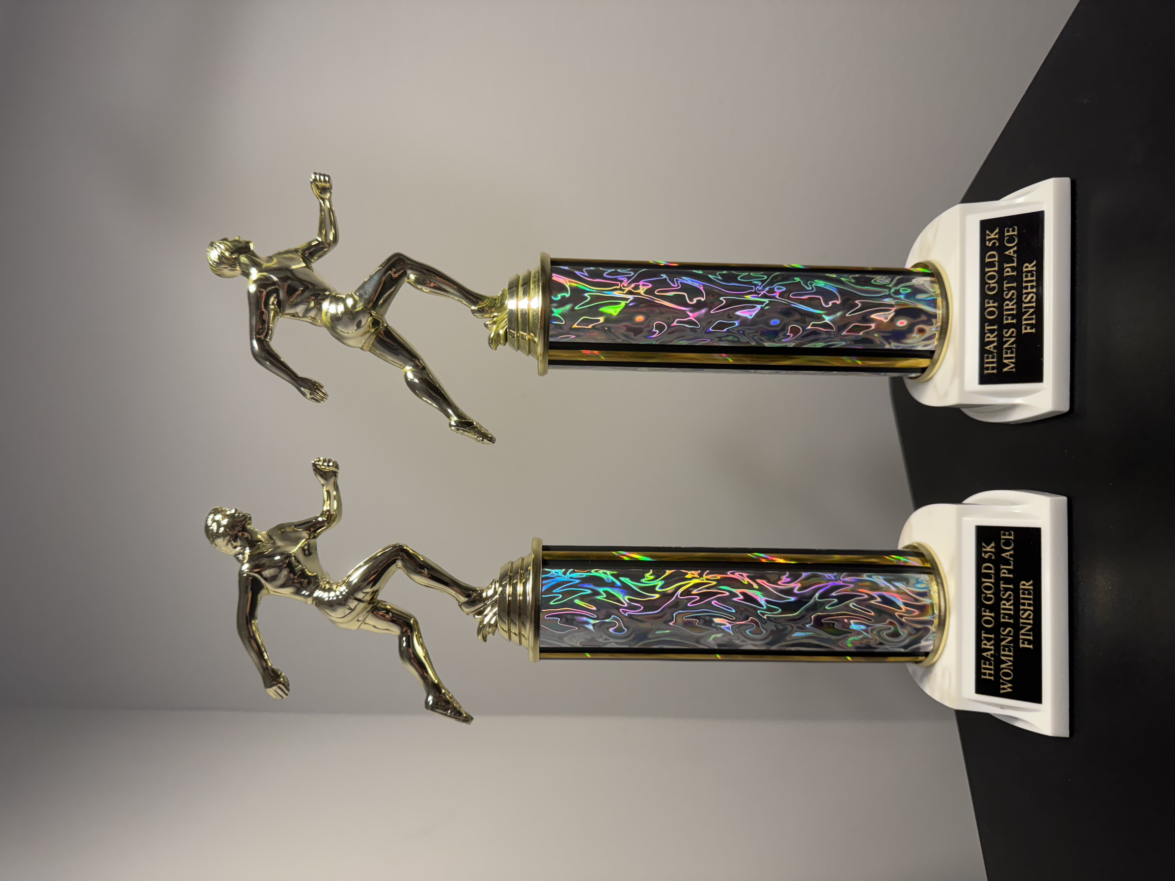 First-place trophies for the Men's and Women's finishers of the Heart of Gold 5K.